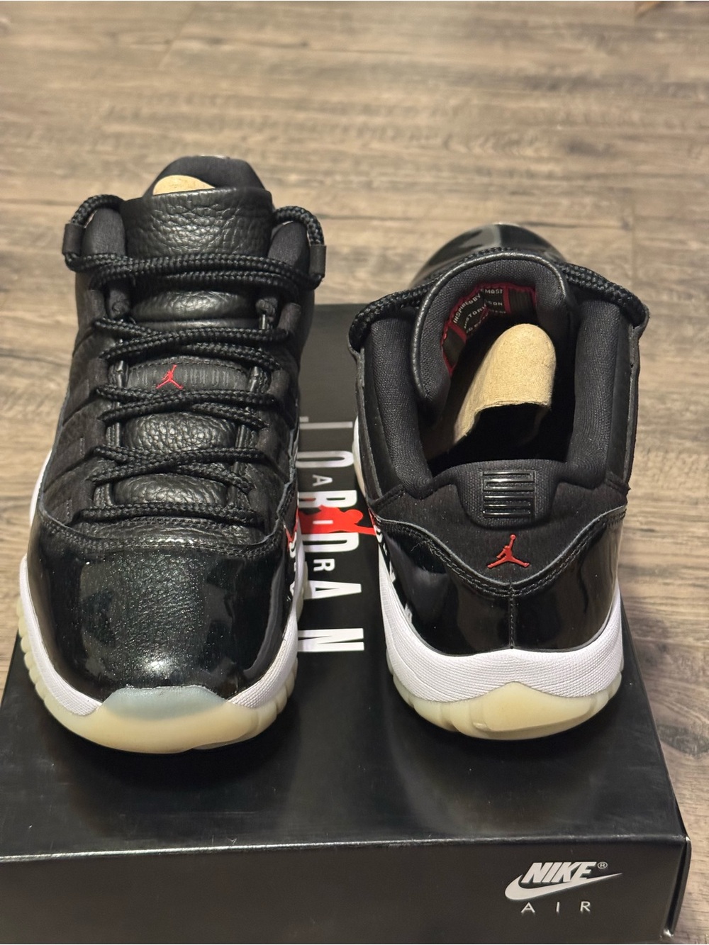 Air Jordan 11 Men's Low-Top Sneakers in Black, White & Red